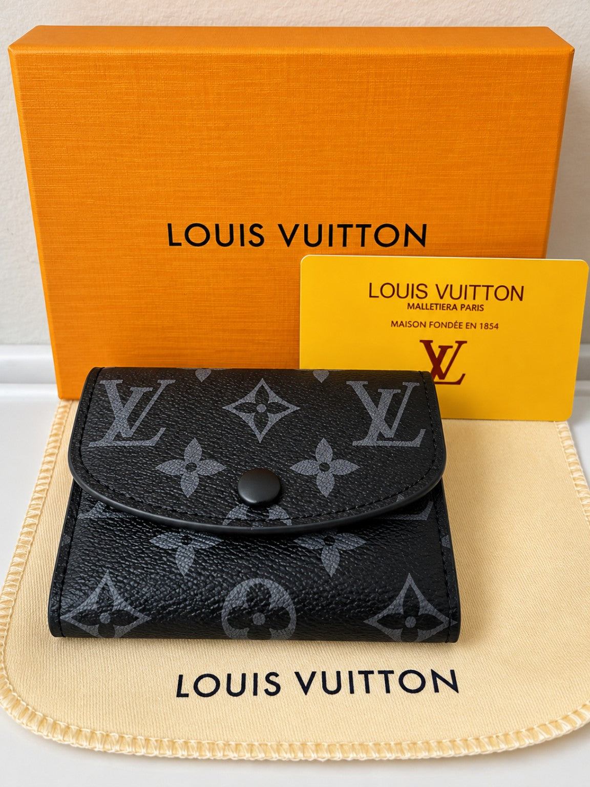 Louis Vuitton Black Monogram Snap Wallet – Compact & Stylishroduct