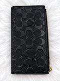 Coach Black Embossed Zip Wallet – Elegant & Stylish